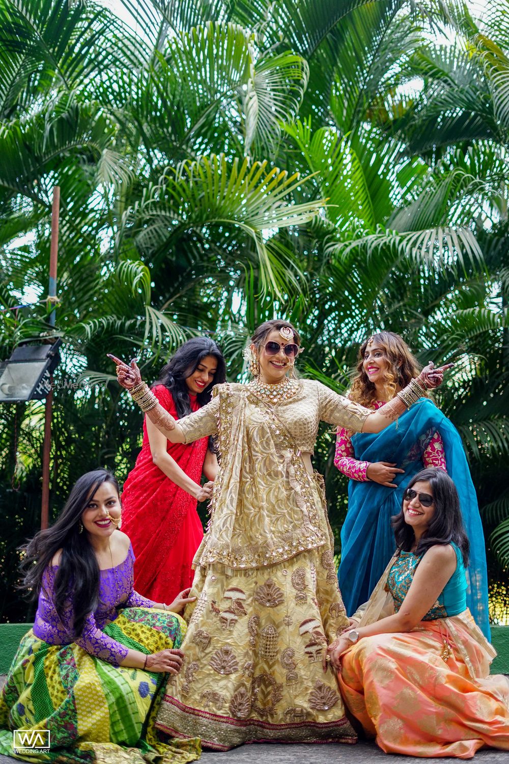 Photo of Bride with bridesmaids in sunglasses