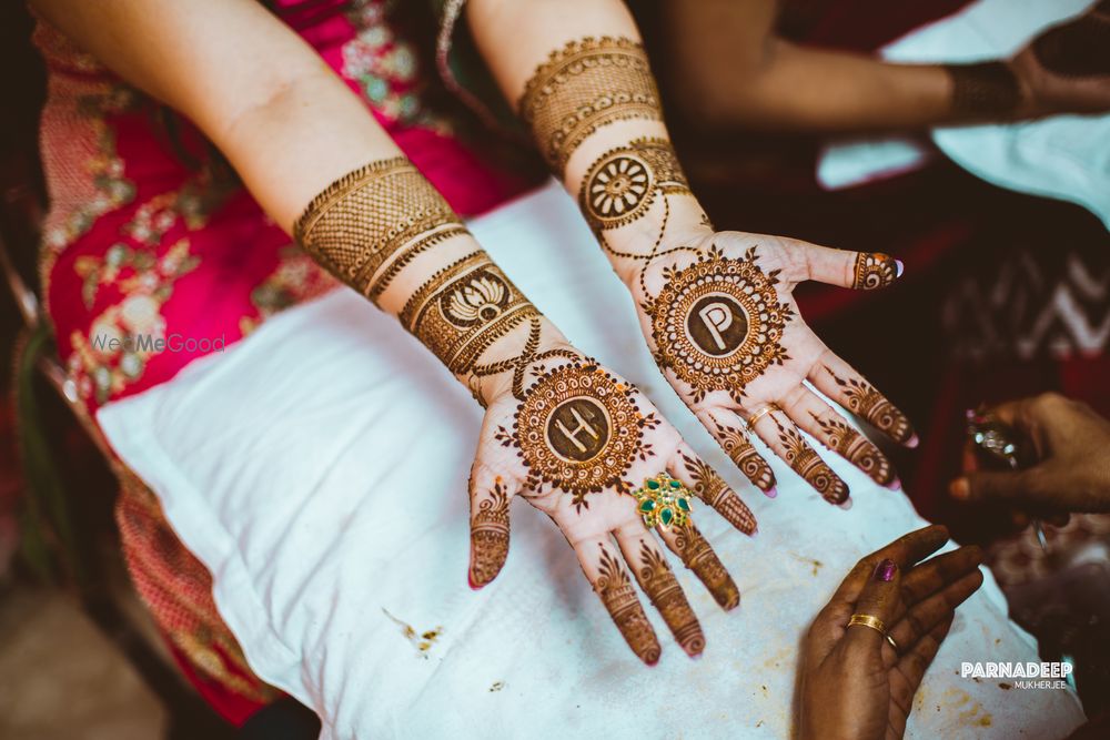 Photo of Modern bridal mehendi design with monograms