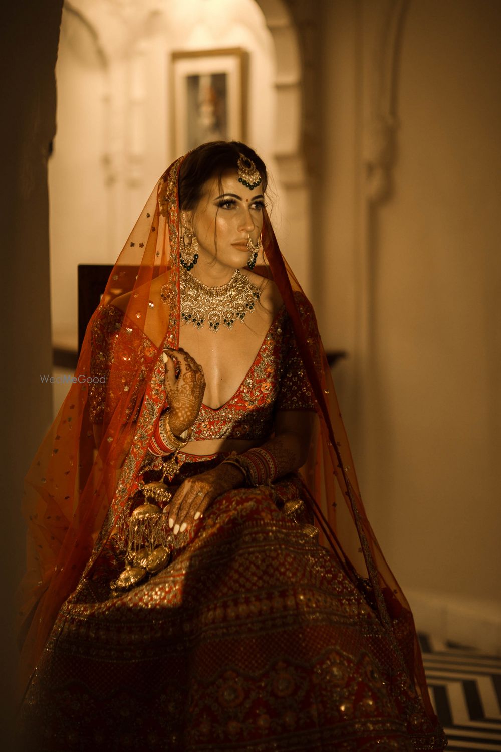 Photo of Classic bridal portrait with bride wearing red