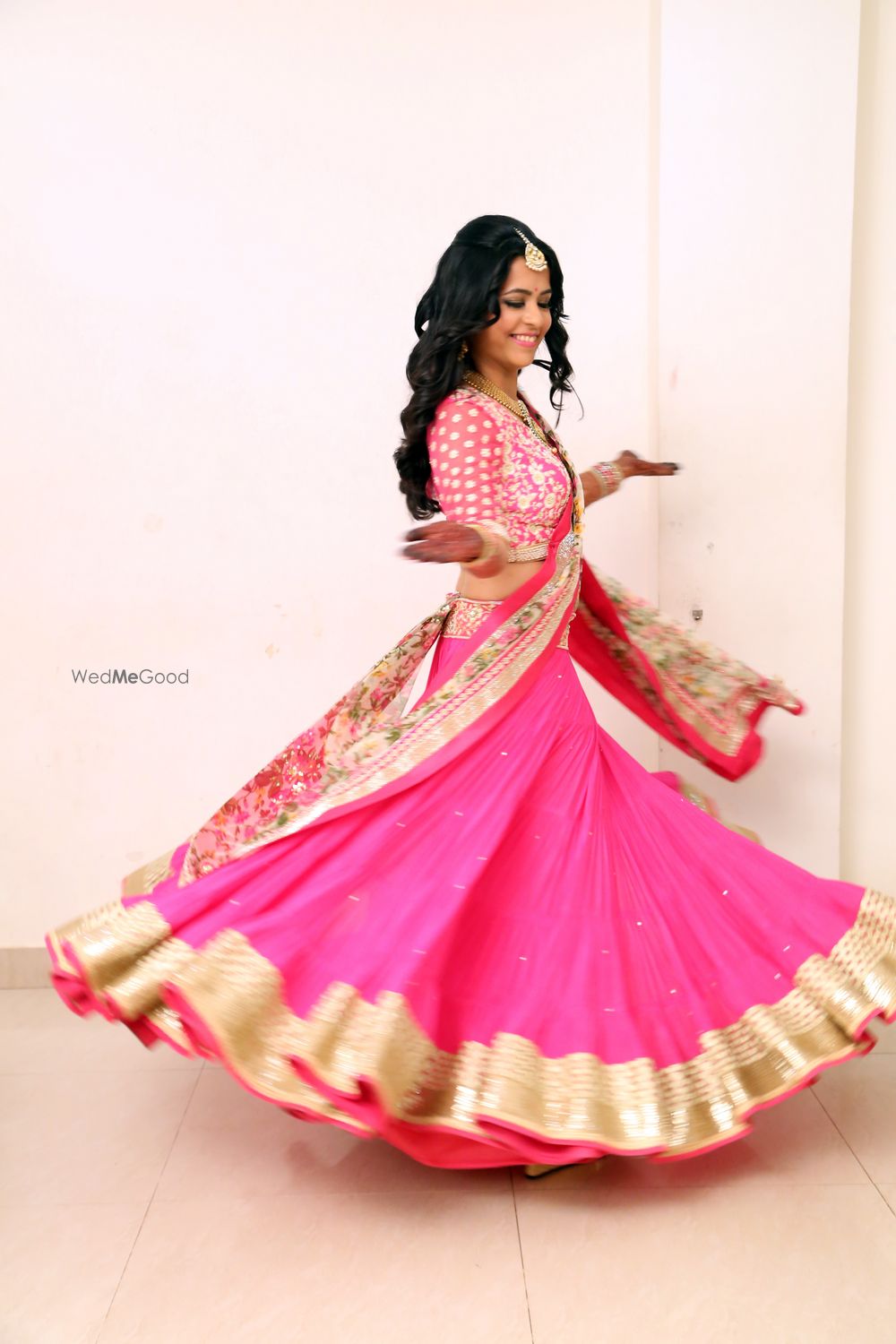 Photo of Fuchsia Pink Twirling Lehenga with Gold Border