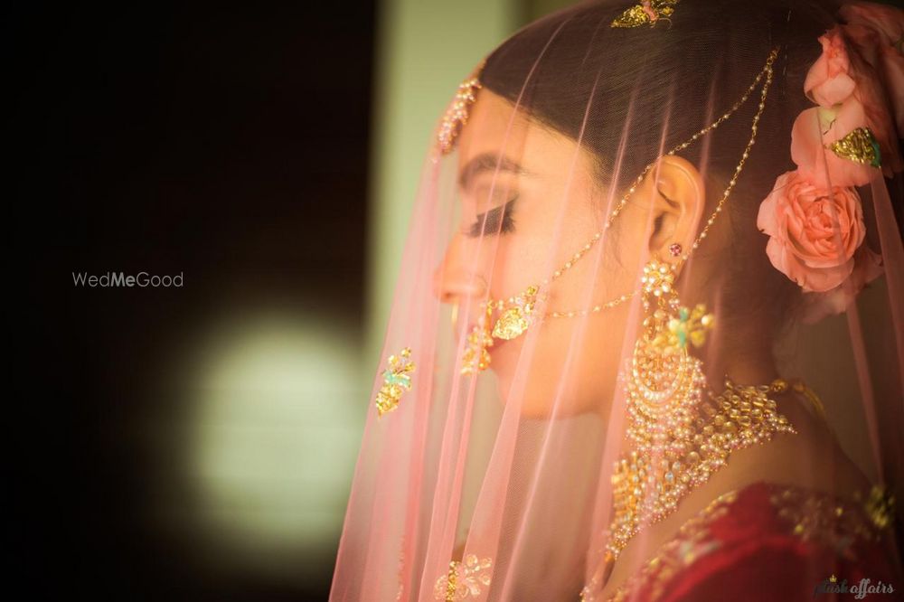 Photo of Bridal dupatta as veil and floral bun