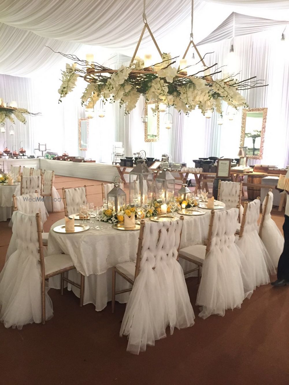 Photo of White Ruffles and Floral Themed Decor