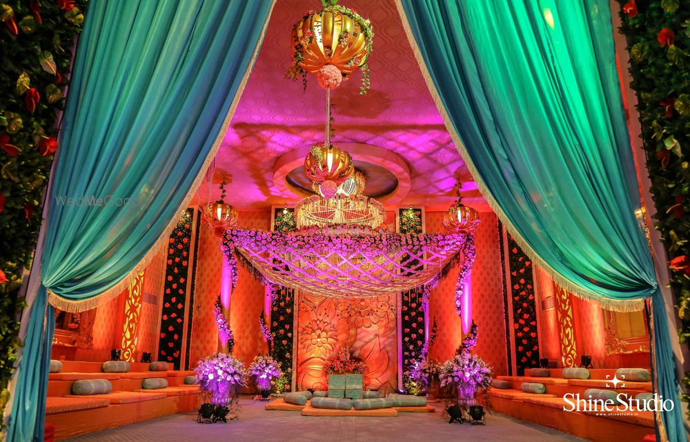 Photo of Teal and orange mandap setup