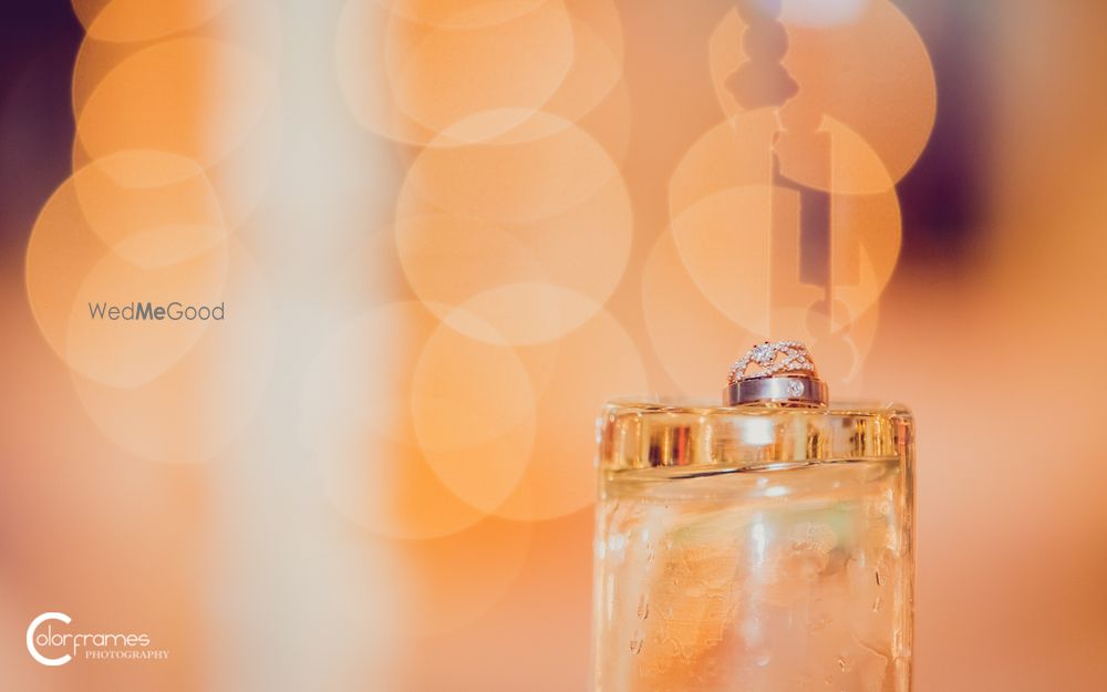 Photo of Engagement Rings on Inverted Glass