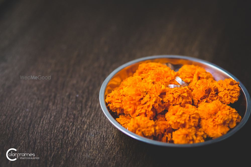 Photo of Engagement Rings in Bowl with Genda Phool