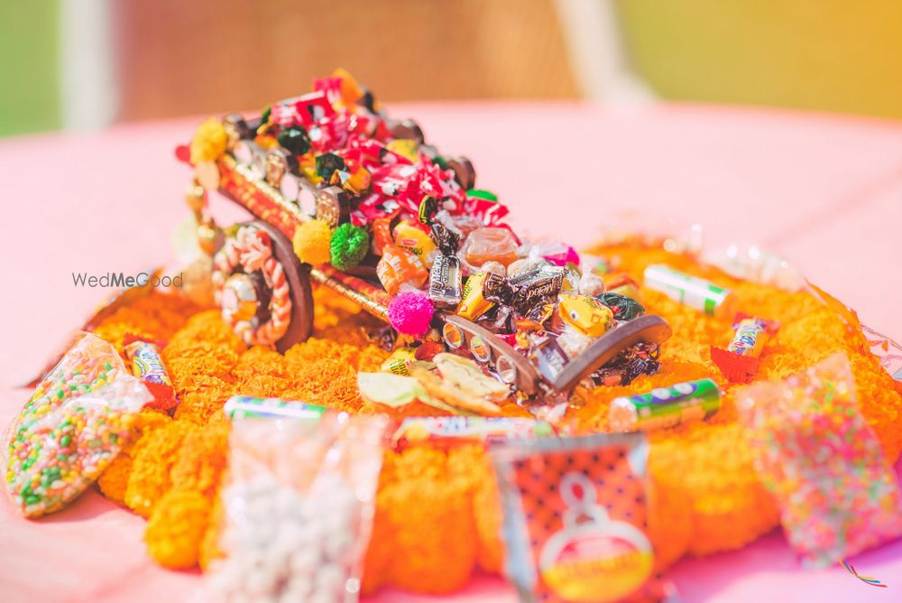 Photo of Floral Wheel Barrow with Candies