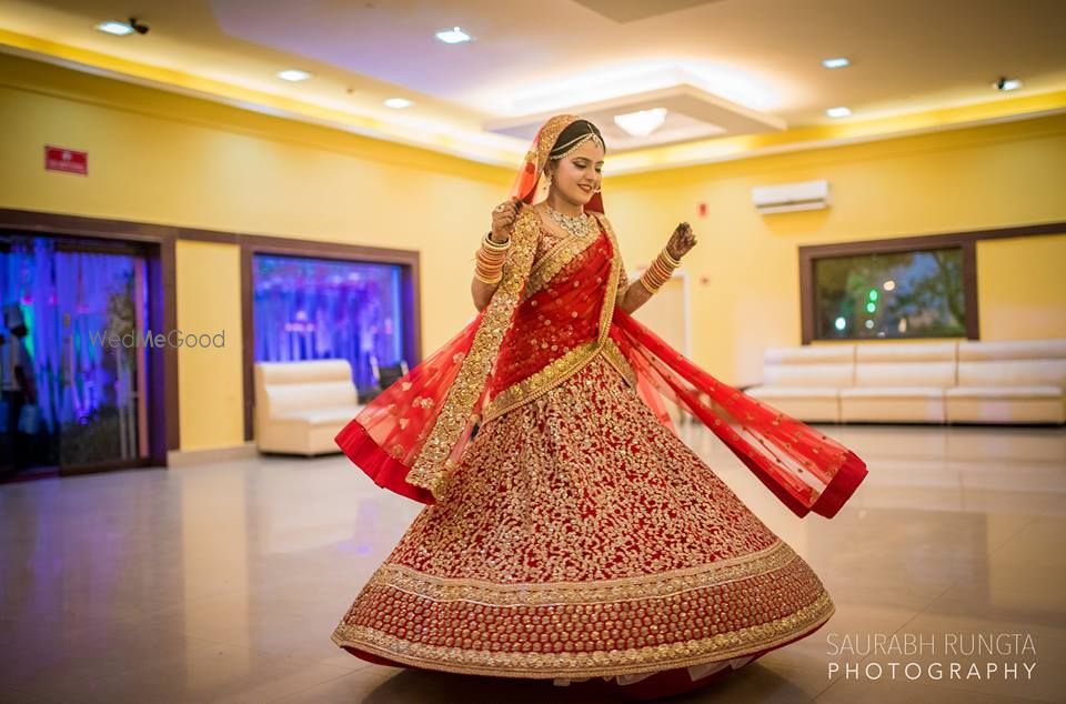 Photo of Twirling Red Lehenga Shot