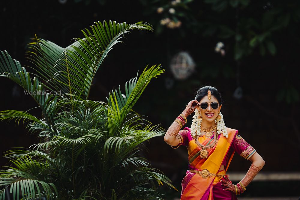 Photo of cool south indian bridal shot wearing sunglasses