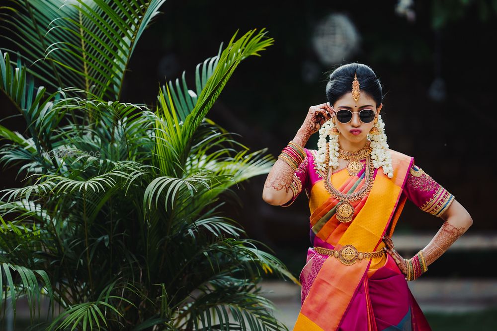 Photo of cool bride shot wearing sunglasses