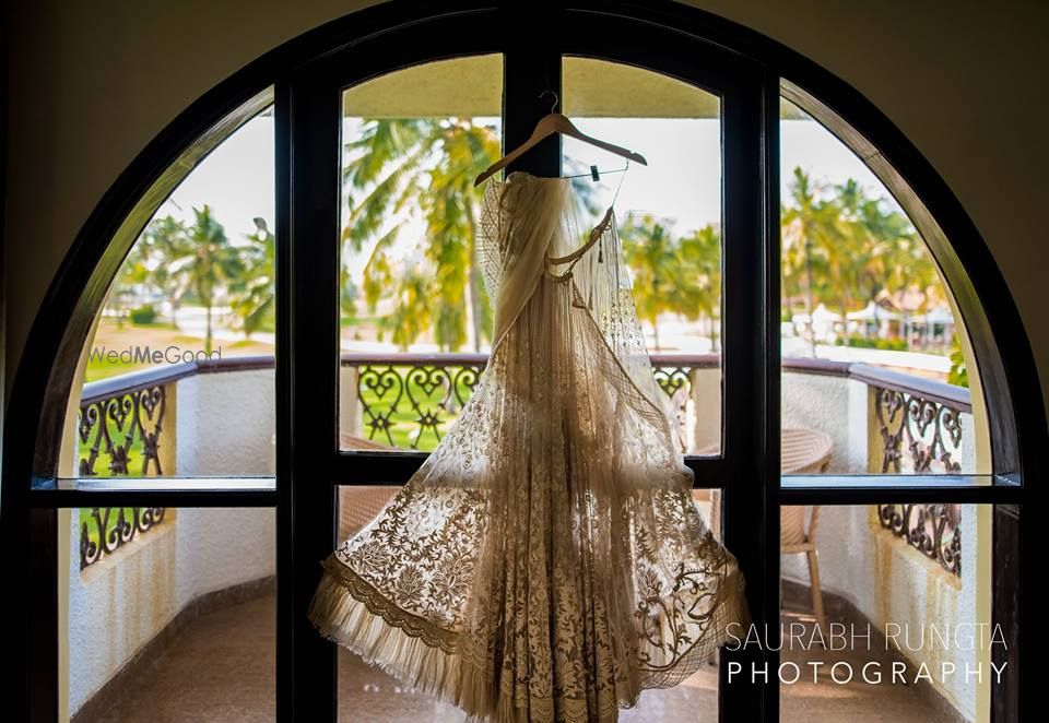 Photo of Champagne Gold Lehenga on a Hanger