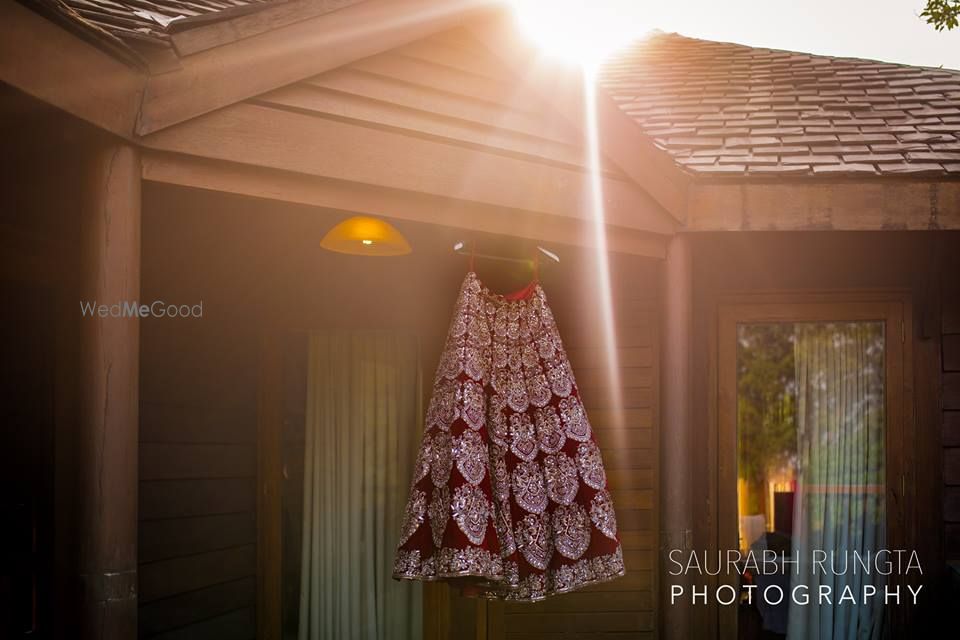 Photo of Marsala Velvet Bridal Lehenga on a Hanger