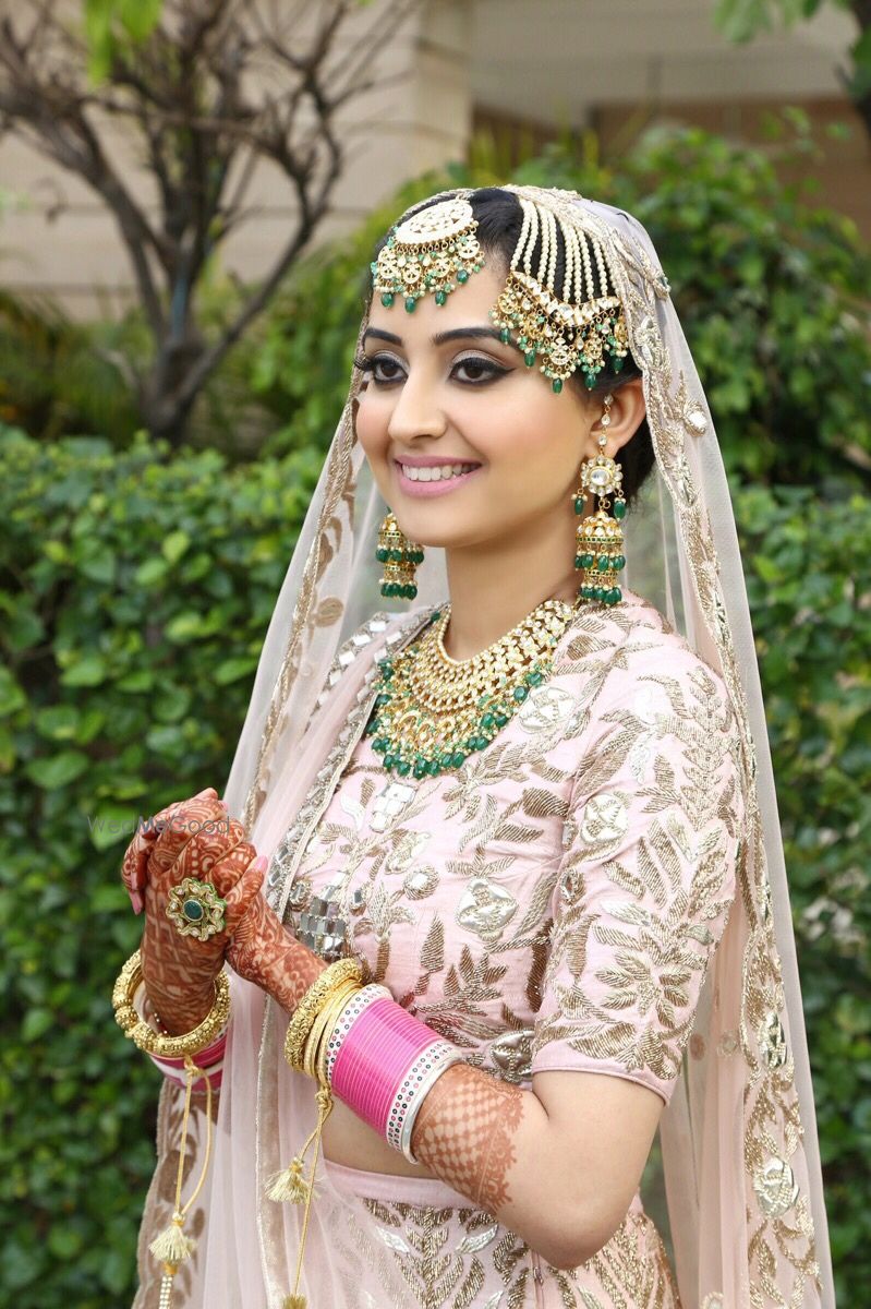 Photo of Gold and green bridal jewellery