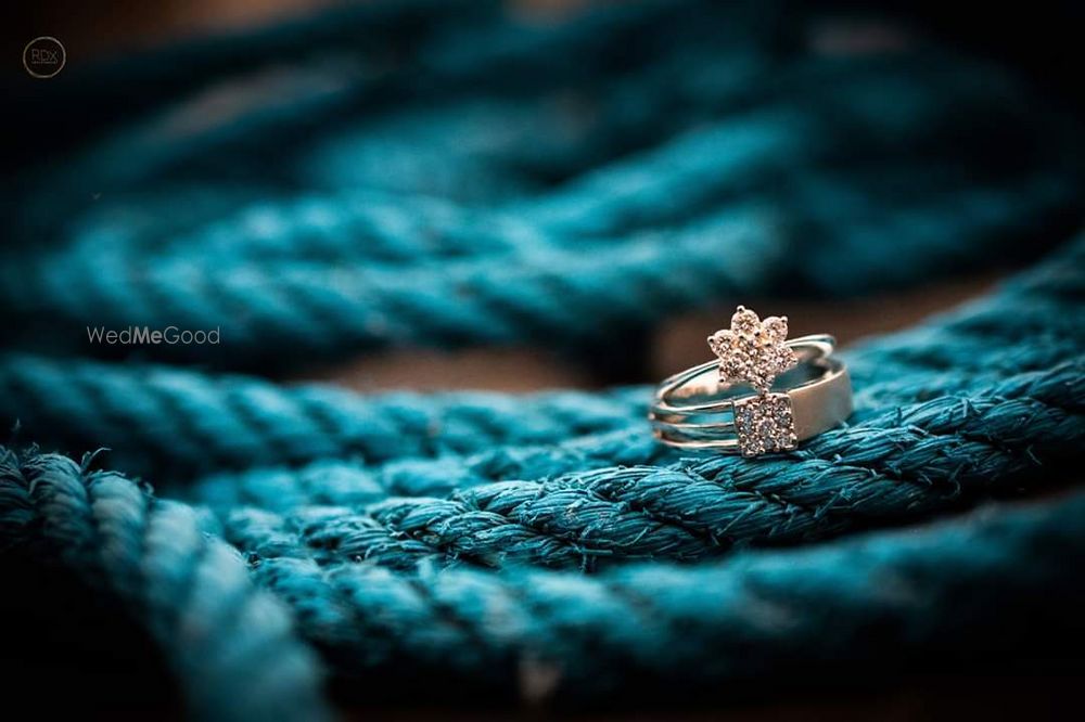 Photo of his and her engagement ring shot