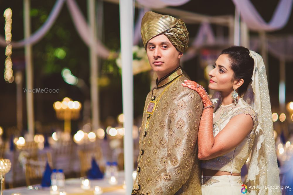 Photo of Gold Sherwani and White Lehenga