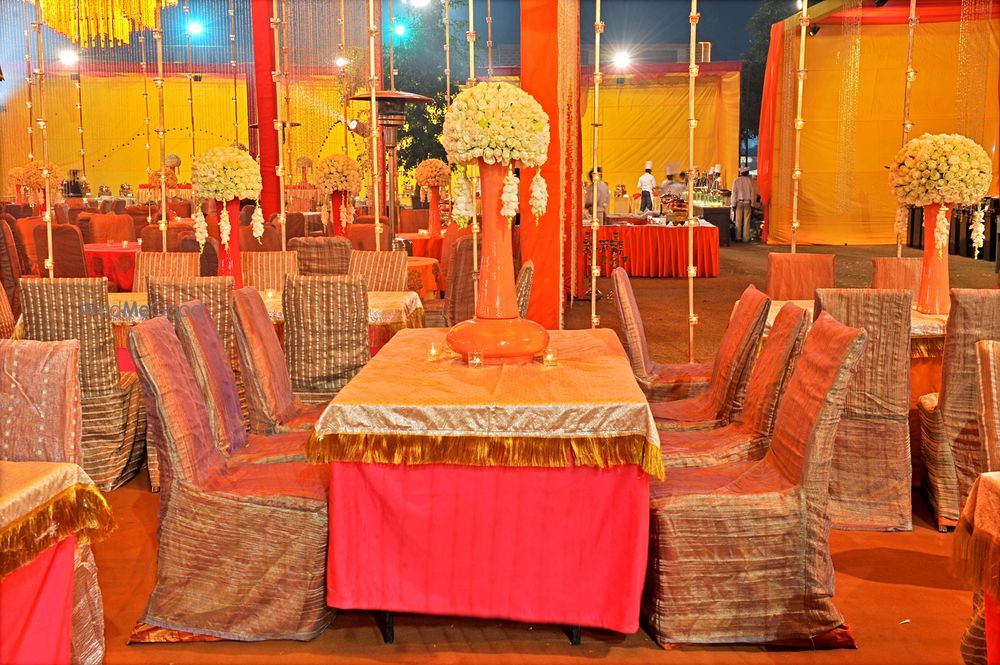 Photo of Gold Table Decor with Yellow Floral Centerpiece