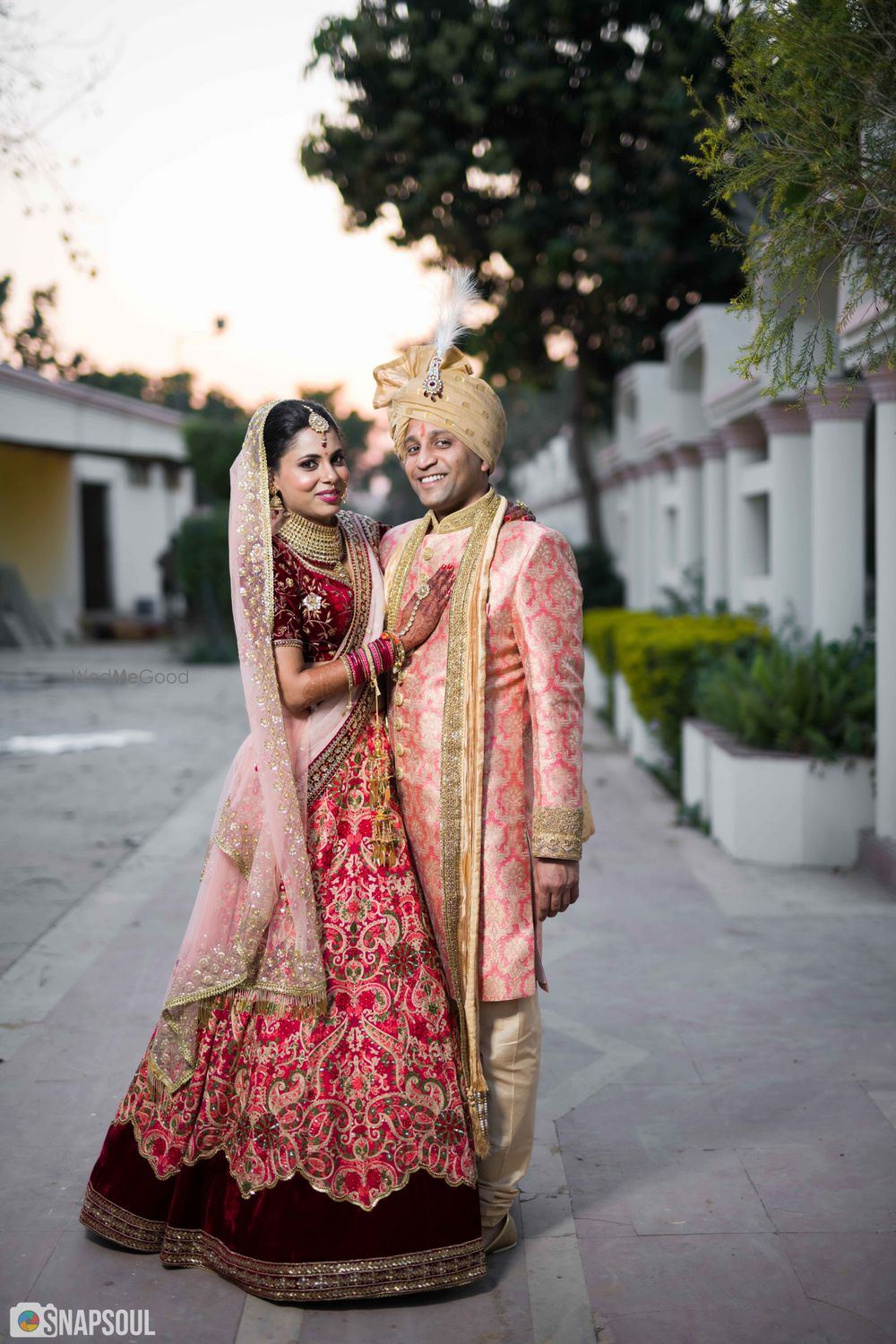 Photo of Wedding day couple portrait with contrasting outfits