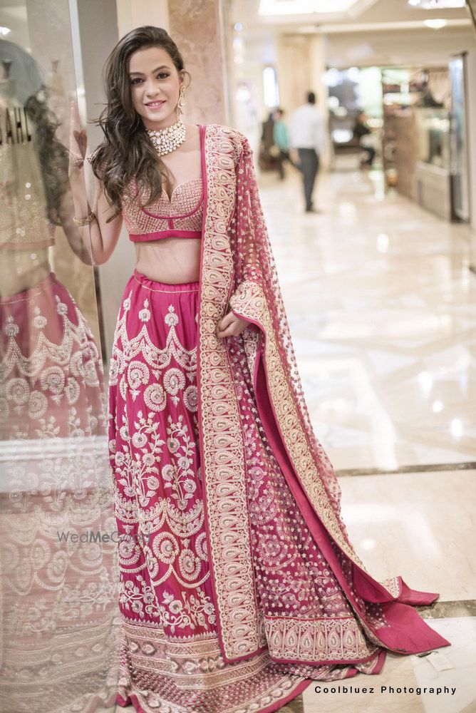 Photo of Dark Pink and Gold Lehenga with Zari Work