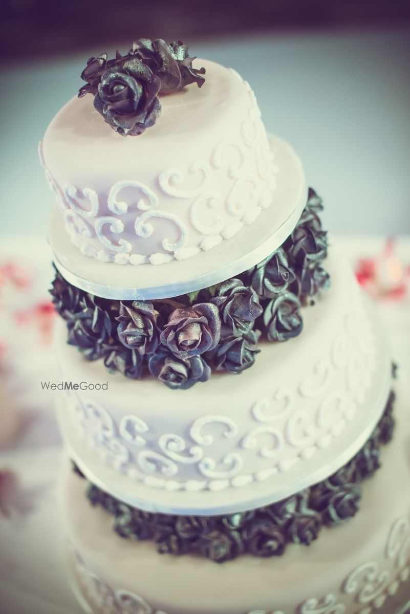 Photo of White and Gray Cake Wedding Cake with Rosettes Decor