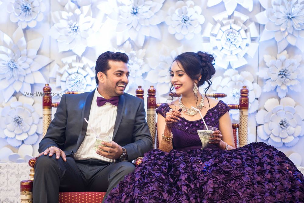 Photo of Couple Portrait in front of White Paper Mache Backdrop