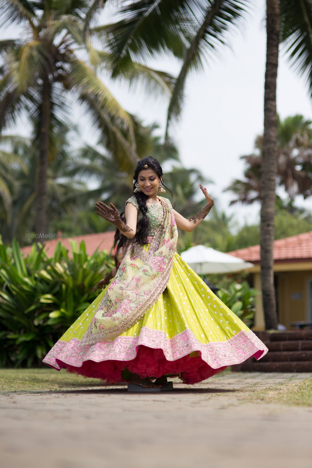 Photo of Floral Print and Neon Yellow Twirling Lehenga