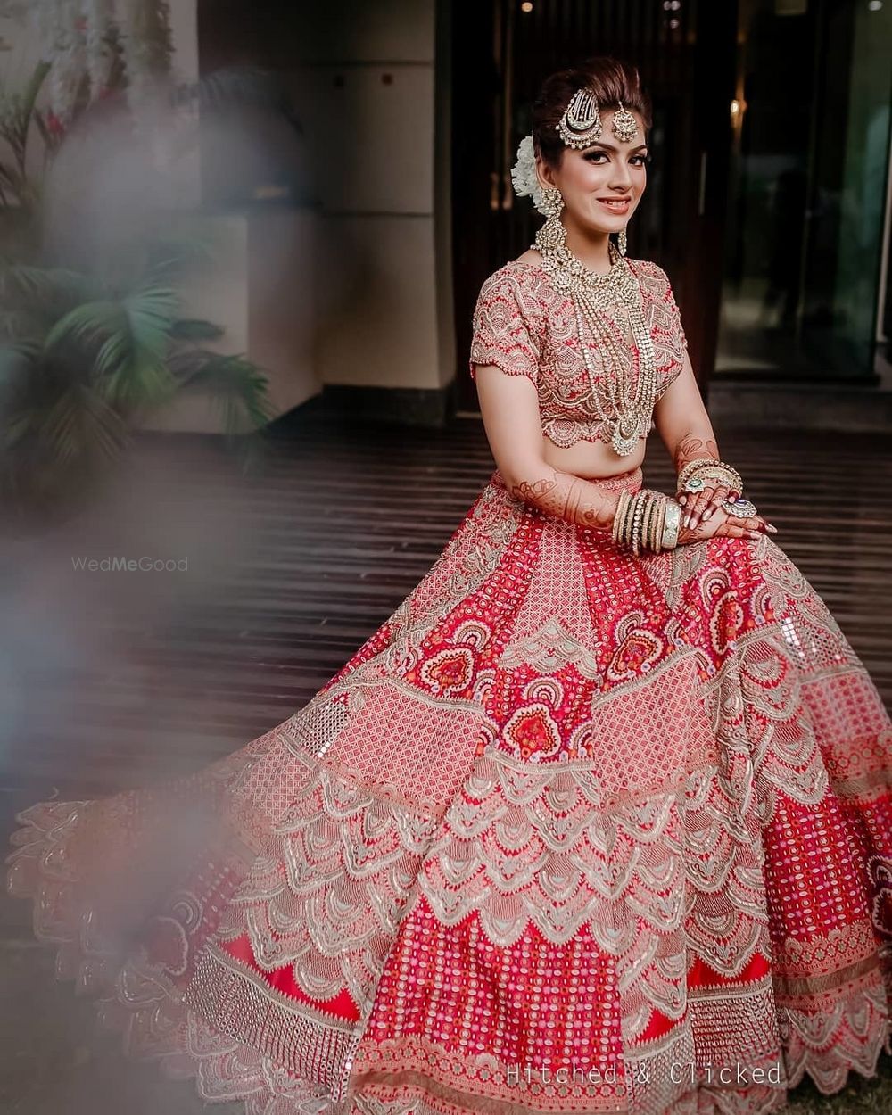 Photo of Bride in heavy patchwork lehenga.