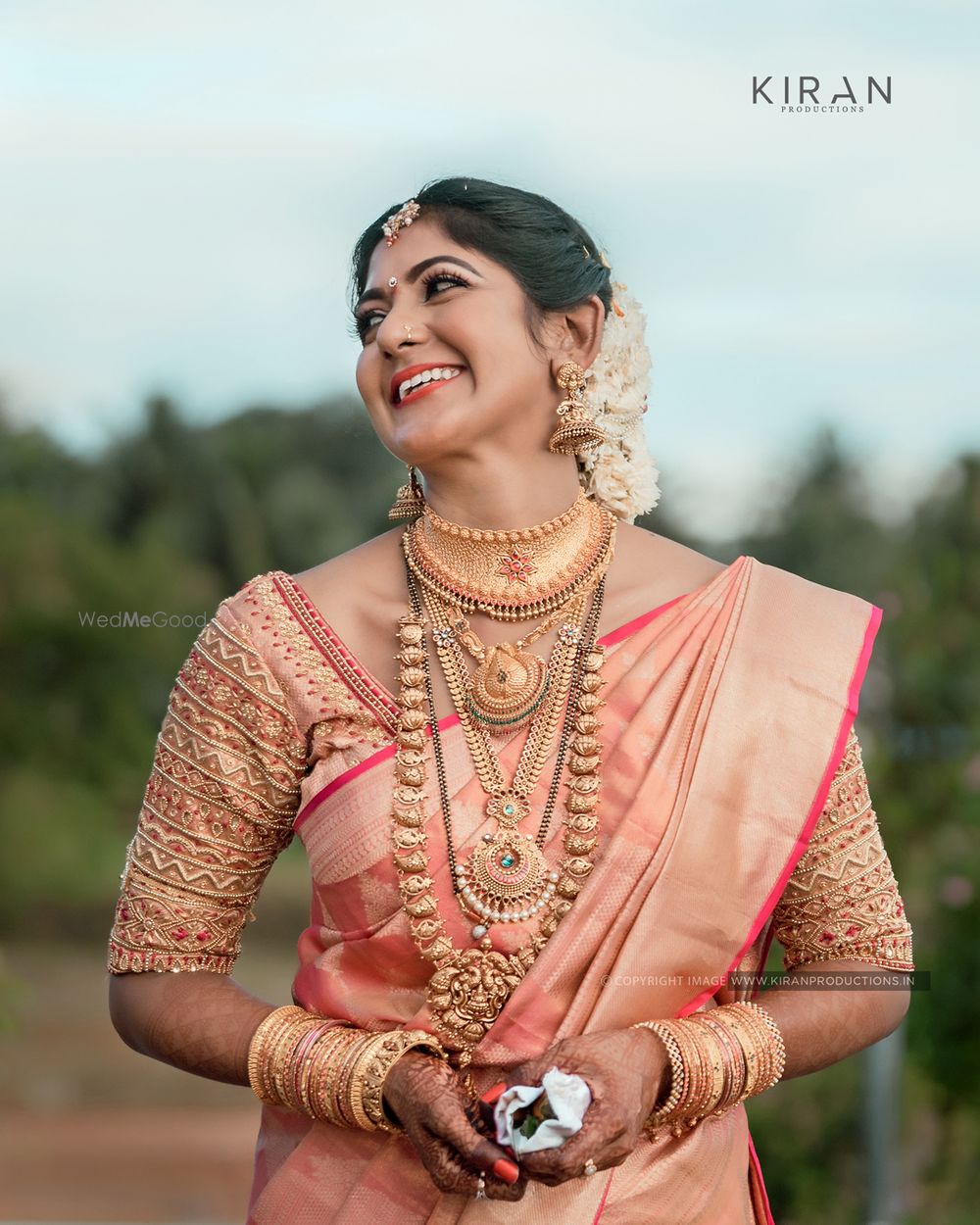 Photo of South Indian bride dressed in pink saree on her wedding day