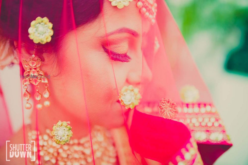 Photo of Hot Pink Bride Through the Veil Shot