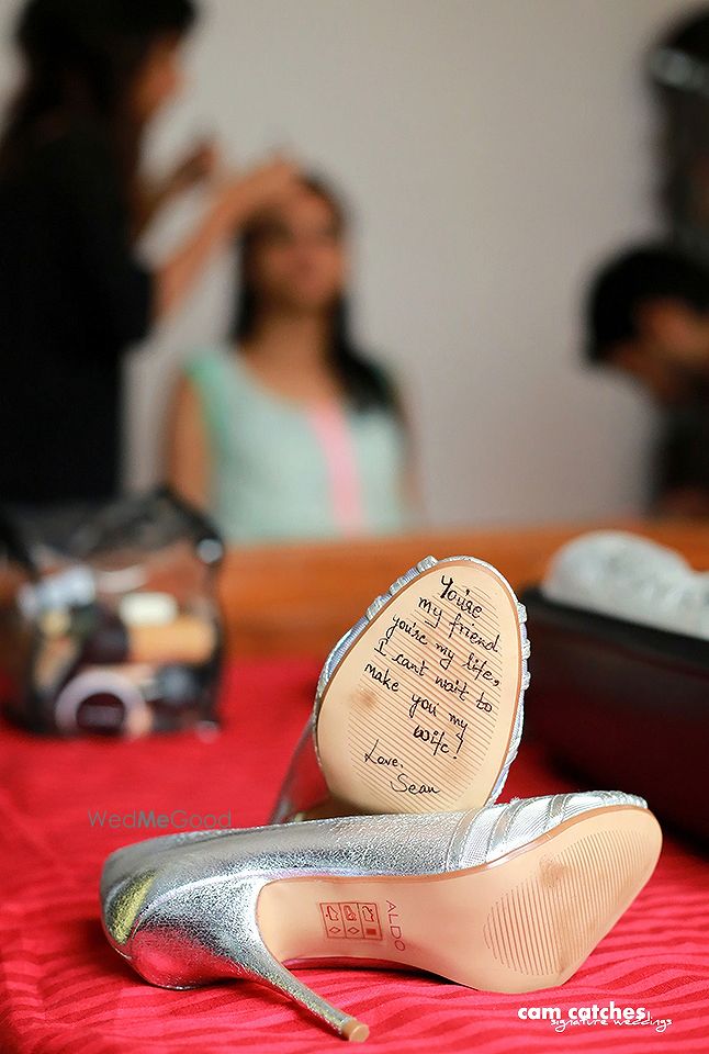 Photo of Love Message from Groom Under Bridal Shoe