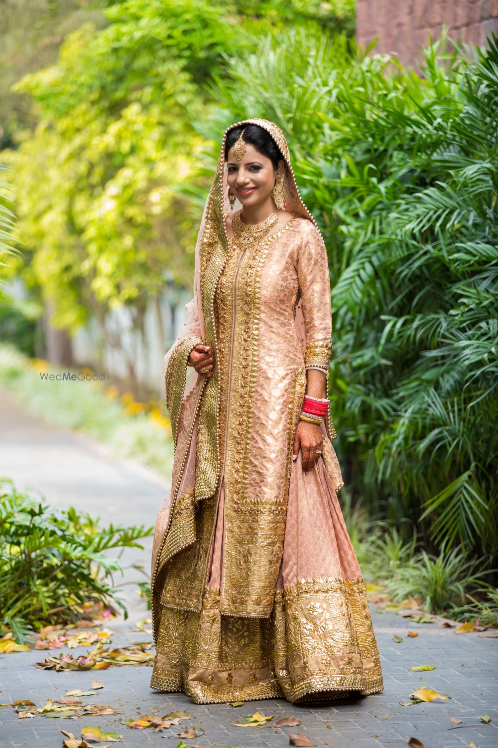 Photo of Light Pink and Gold Bridal Lehenga with Jacket Blouse