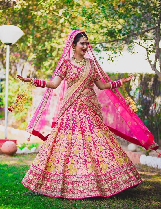 Photo of Bright Pink Lehenga with Yellow Thread Work and Zari