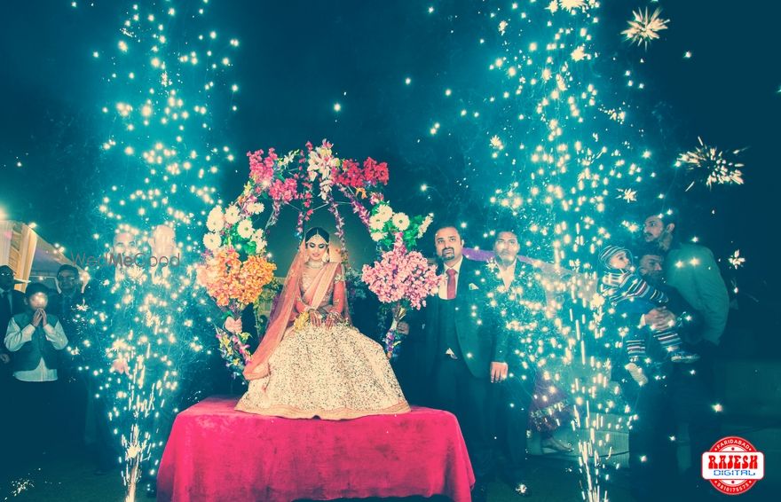 Photo of Bride Entering on Floral Moving Stage and Fireworks