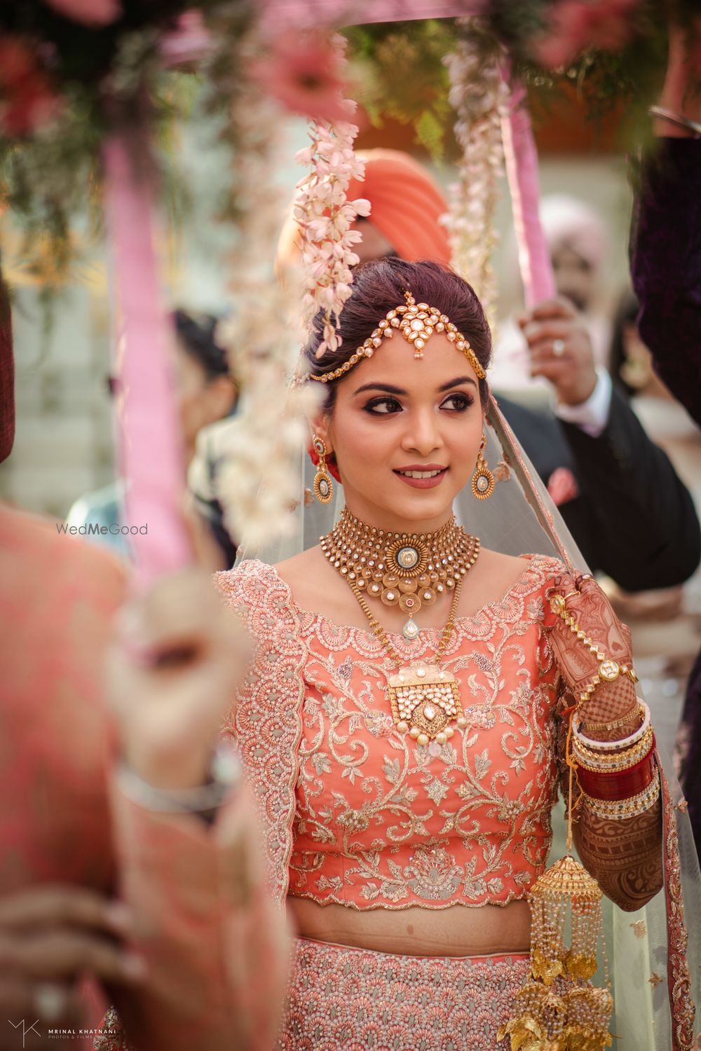 Photo of Candid shot of a bride during her entry.