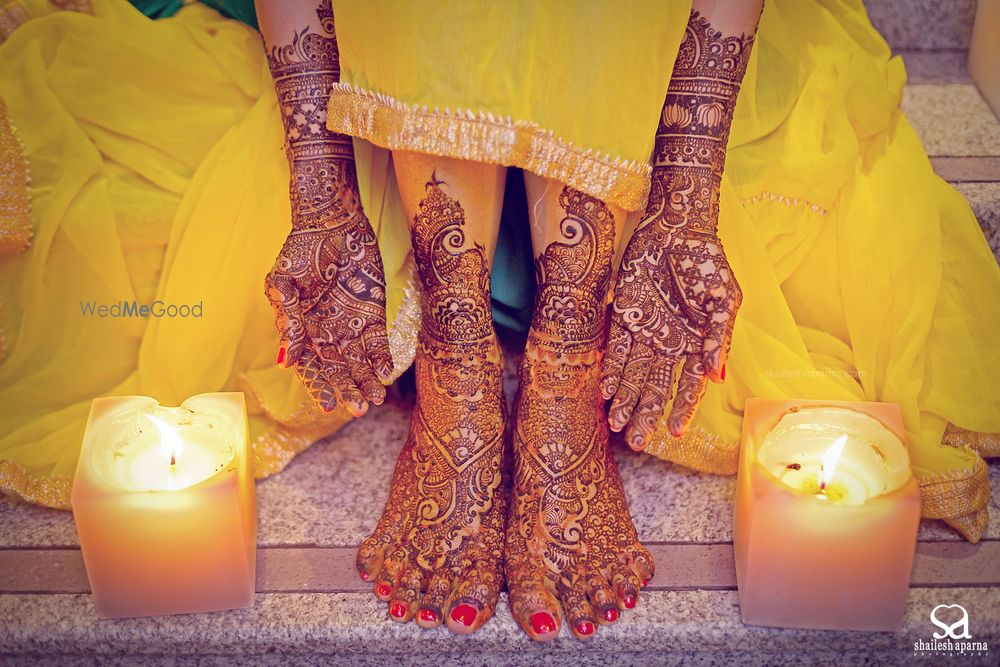 Photo of Bridal Mehendi on Hands and Feet with Candles