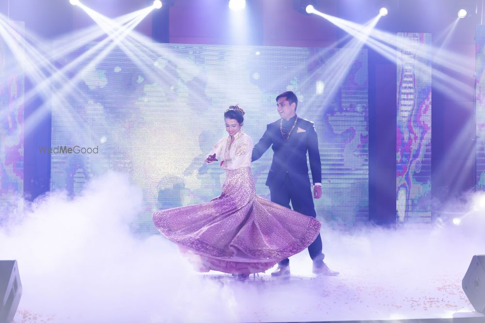 Photo of Bride and Groom Romantic Dance Onstage