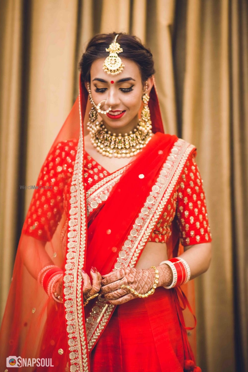 Photo of Minimal bridal lehenga with bride in red