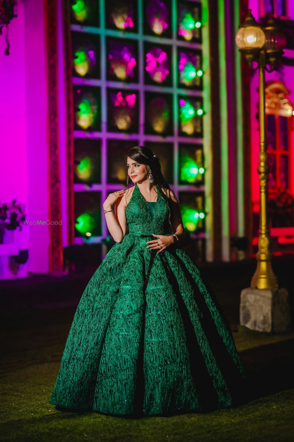 Photo of emerald green gown with sequin work