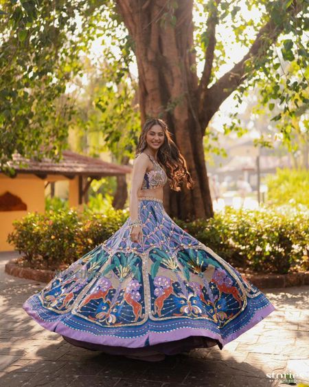 Photo of Celebrity bride on her haldi day twirling away in a blue lehenga