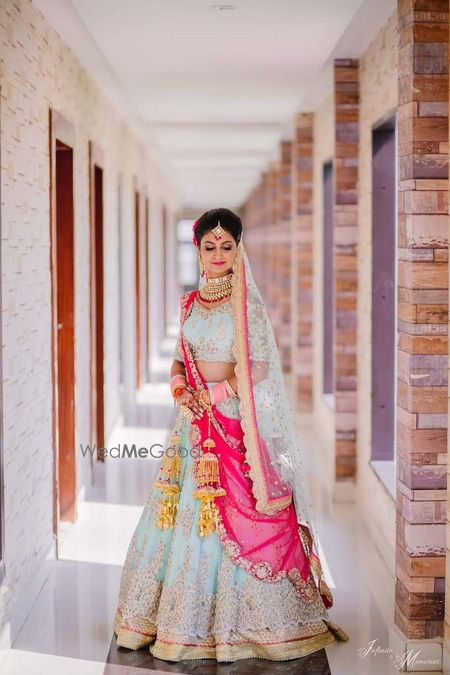 Photo of A bride in powder blue lehenga.