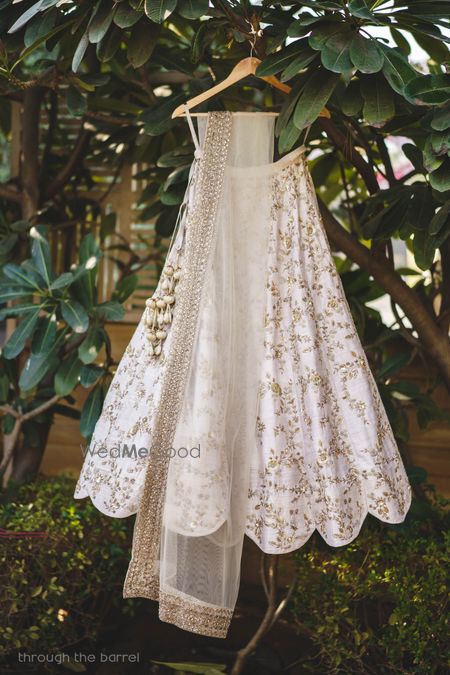 Photo of Minimal white bridal lehenga on hanger