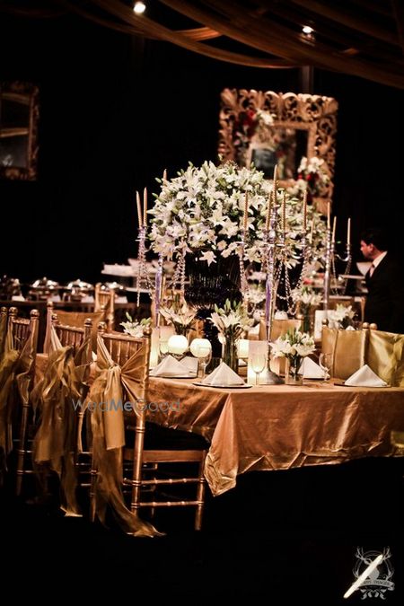 Photo of glamorous table settings with back decor