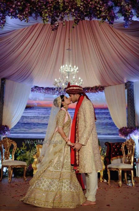 Photo of Wedding day couple kissing shot