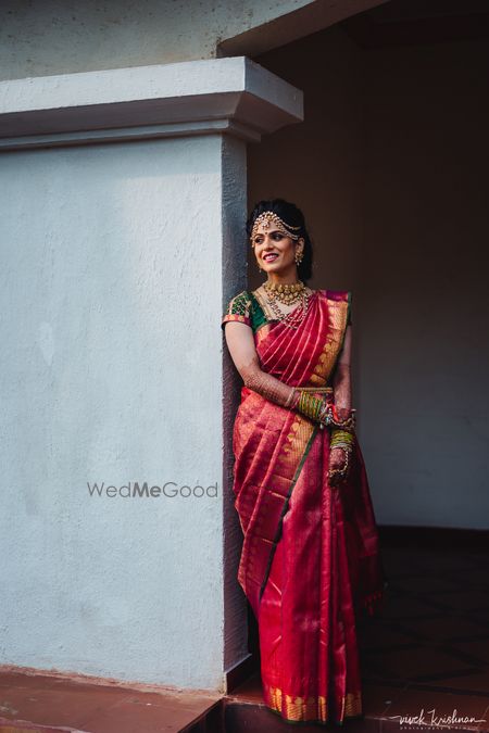 Photo of South indian bridal look in red and green kanjivaram