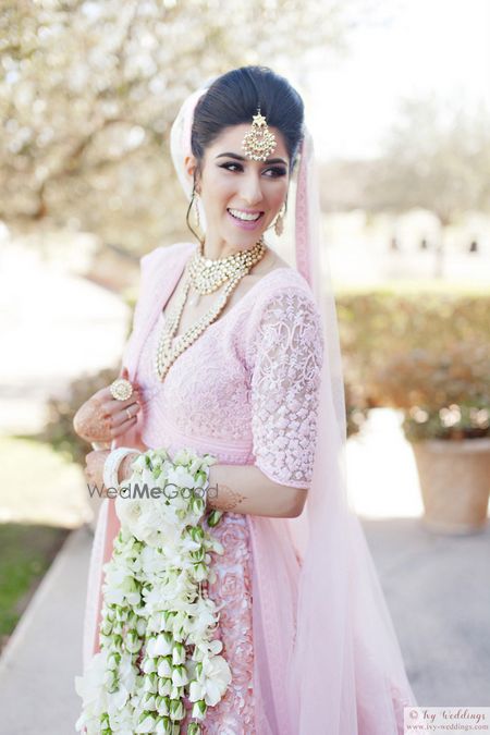 Photo of Unique bridal kaleere with white and green roses