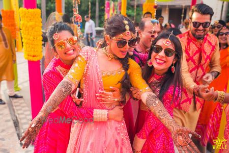 Photo of Bride with Bridesmaids on Mehendi with Sunglasses