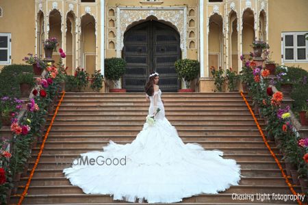 Photo of Ruffled White Wedding Gown with Dramatic Train