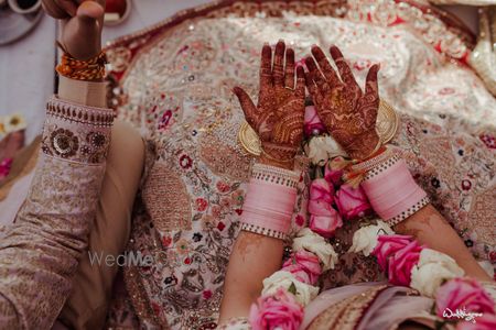 Photo of offbeat light pink pastel chura for bride