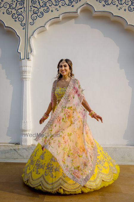 Photo of Bride twirling around on her Mehendi.