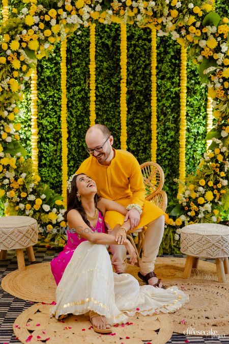 Photo of candid couple pose on haldi day