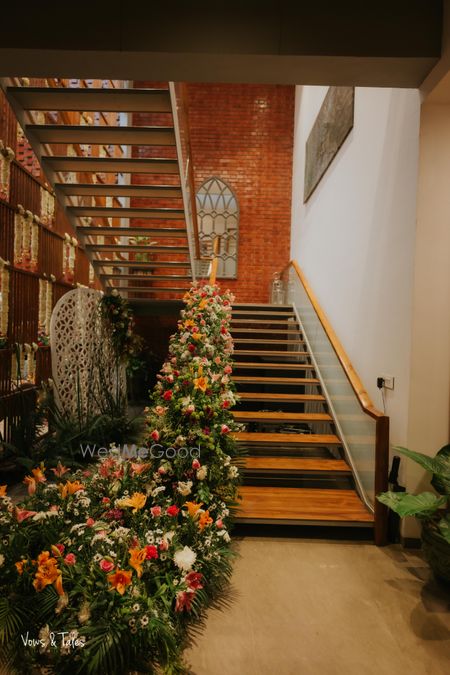 Photo of Beautiful stairway decor with multi-coloured florals