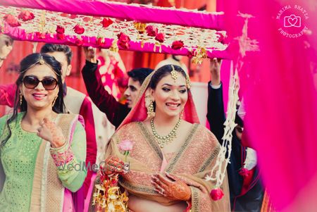 Photo of bride entering with rose